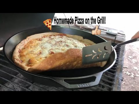 How to make homemade pizza in a 17” cast iron skillet in a charcoal grill! Bonus homemade bread!