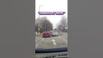 Handbags at merge caught on dashcam - two drivers get into road rage at a merge in turn location