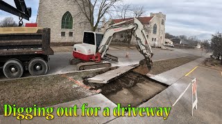 Tearing Out A Sidewalk For A New Driveway And Digging A Sewer Line