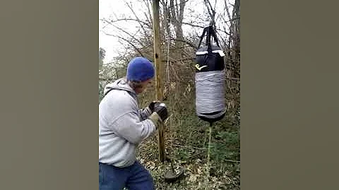 Old man hitting heavy bag, 66 year old, trying aga...