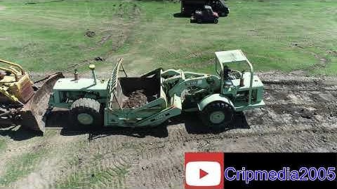 Cat D8k loading terex scraper drone