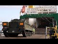 British Army vehicles being loaded for transport to Estonia the day before Russia invaded Ukraine