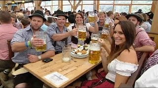 Rain pours, beer flows as Munich Oktoberfest begins