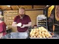 Fried Langos from Hungary and Fried Potato Pancakes. Street Food Tasted in Prague, Czech Republic