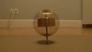 Electric Heavy Enclosed Spinning Top on Low Friction Surface 0:30. Initially Vertical