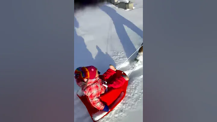 Evelyn sledding with dad!