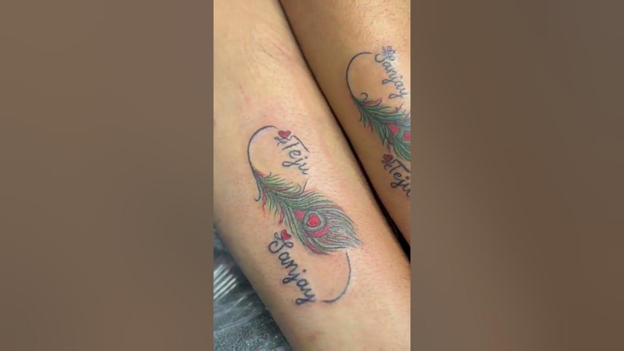 Couple tattoo /couple goals/ name tattoo / feather tattoo / color tattoo /  tattoo by krupa - YouTube
