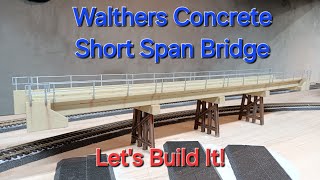Lets Build This Walthers HO Scale Modern Concrete Bridge
Trains can now safely pass over the Greene River on my UP St. Marshall Sub layout.
This Walthers Short Span Concrete Bridge kit was fun to build, and very customizable for different installation needs.
This video highlights the steps I followed to build the bridge. For the most part, the instructions were sufficient. Just think through the entire build process before starting, so you have a good idea what needs done and in what order.
Basically, I used left-over Christmas wrapping paper to tape all the parts to after I cut them from the sprue. This way I can work efficiently by focusing on one task at a time. Cut everything, sand everything, glue everything, then paint everything.
By taping the parts to the paper, I can write their part numbers with the parts, in case the kit takes several nights to build.
Weathering was straight forward with Pan Pastel chalks, but you could airbrush the weathering and it would look just as good.
Any comments or questions, leave those down below, then take a second and share this video! Thanks friends. Lets Build This Walthers HO Scale Modern Concrete Bridge