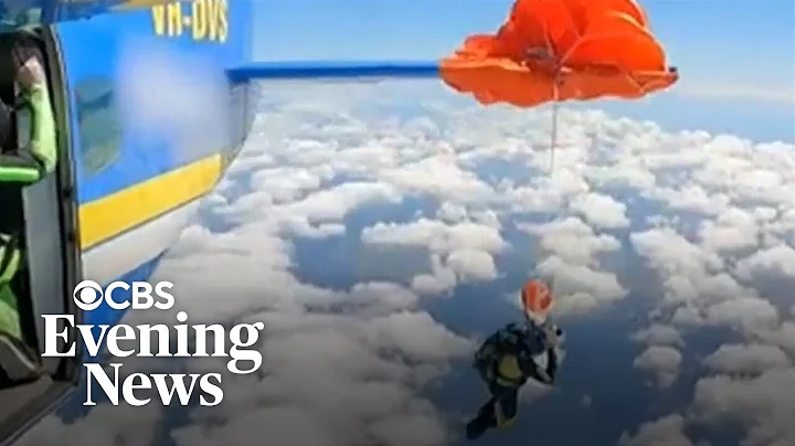 Video shows skydiver dangling from plane after parachute mishap