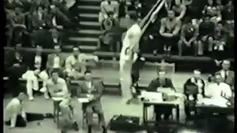 Unknown gymnast on flying rings (with two release moves and maybe unplanned cartwheel dismount)