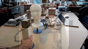 Real-time neuro-inspired sound source localization and tracking architecture applied to robotics