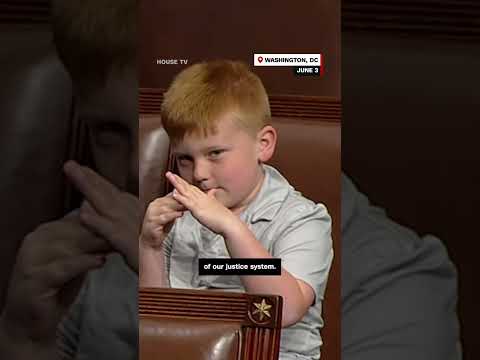 Congressman's son pulls funny faces behind dad during House floor speech