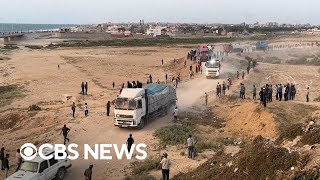 Trucks carrying desperately needed aid are rolling across a newly U.S. built pier into Gaza