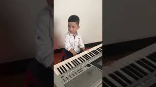 Junior playing piano