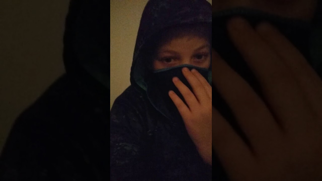 Looking like a ninja saying some thing 