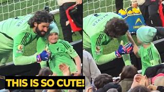Alisson shares a lovely moment with a young Liverpool fan after the win over West Ham