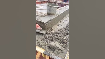the process of leveling the cement mixture with a simple tool  #shorts