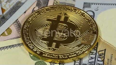 Gold Bitcoin Coin, BTC and Bills of Dollars Are Rotating (Stock Footage)