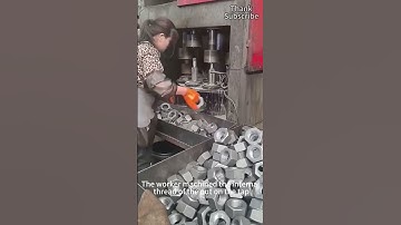 Workers process the internal threads of nuts on taps