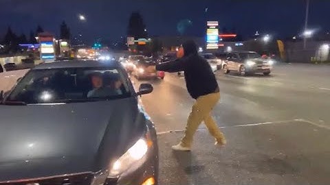 BLM agitators blocking Tacoma traffic - throwing ketchup at people standing up against them