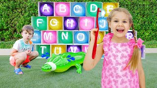 Diana and Roma learn the alphabet with balloons