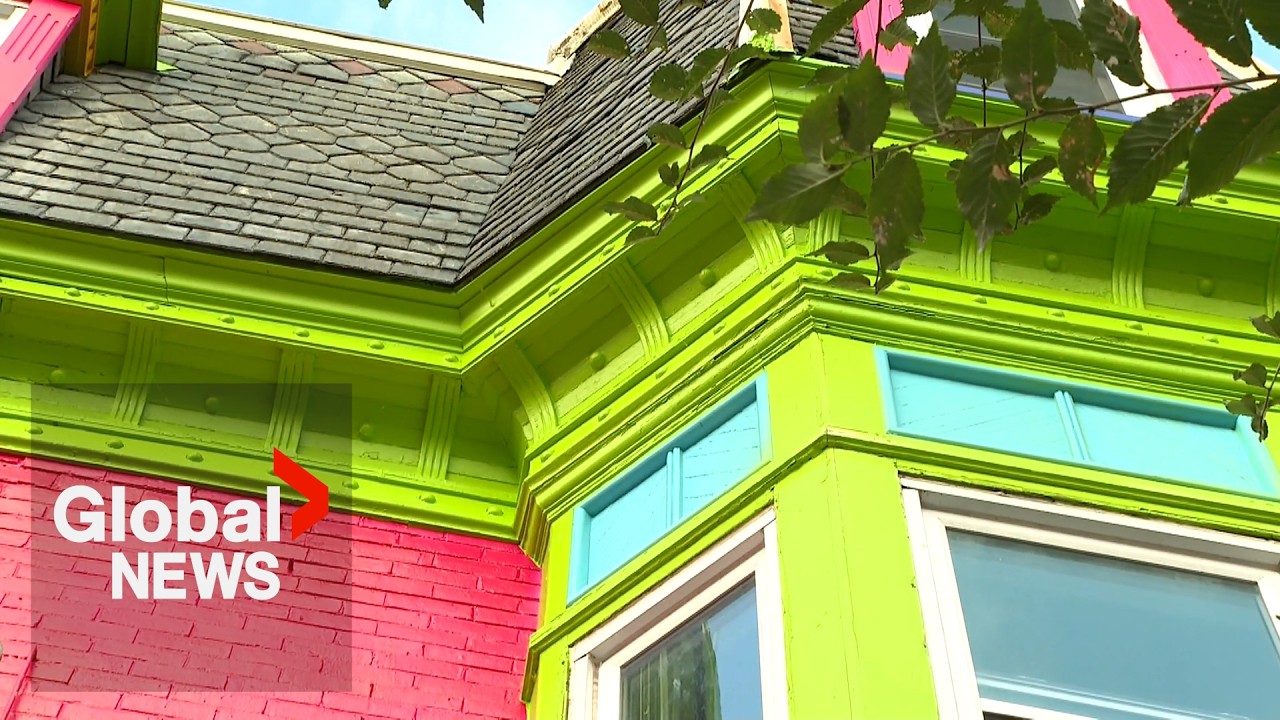 Montreal officials see red after century-old home turned into colourful billboard