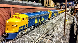 MTH Alaska Railroad E8 A-B Units #2401 pulling 8 Alaska RR passenger cars on Corner Field Model RR