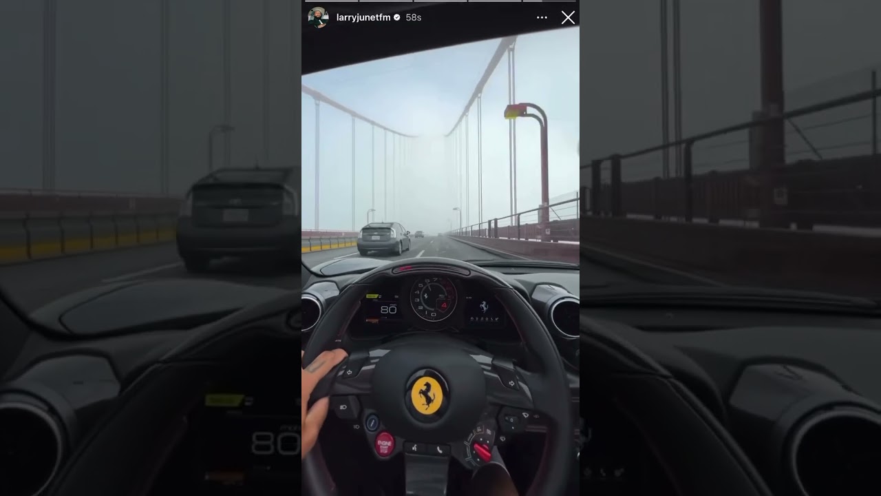 Larry June driving his Ferrari 