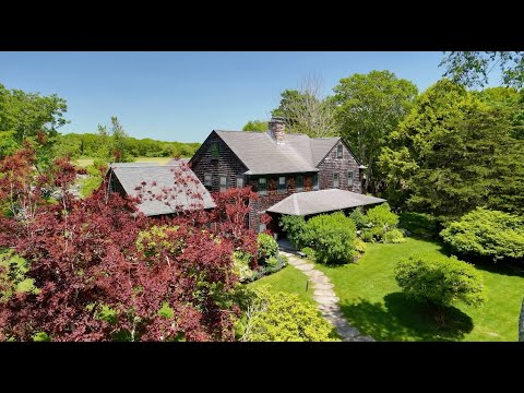 Welcome to one of Rhode Island’s most idyllic estates less than a mile from the Atlantic Ocean. A tree lined enchanted entrance leads to over four and a half acres of manicured lawns, gardens and woodlands. Trustom Pond, a national wildlife refuge, is across the street, and over 41 acres of preserved farmland owned by the state of RI provide privacy and natural beauty behind the property. Four structures grace the site, including the main house, a two-car garage, a dedicated gallery, and a guest house. Surrounded by charming New England stone walls, the main house was meticulously built in 2001 with wide plank pine floors, two woodburning fireplaces, a beautifully done kitchen with honed soapstone countertops, three bedrooms, three and a half baths, and a third floor bound to be a cozy gathering spot. The separate two car garage, built in 2010, has a 23'3 x 15'10 finished second floor office serviced by a separate interior stairway. There is a 33’11” X 22’6” finely built gallery with servery, special lighting, and gorgeous hardwood flooring. There is a finished basement with wine cellar. Finally, there is a one-bedroom guest house, built in 2014, complete with a walk-in closet, modern full bathroom, a sitting room with wood burning stove, and fabulous views of the garden and the beautiful fields beyond. Beware--your houseguests may never want to leave. This property is a masterful combination of refined and casual comfort, and serenity with lovely views in all directions. 1049 Matunuck Schoolhouse Road, South Kingstown, RI