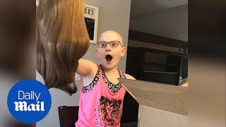 Heartwarming moment little girl with alopecia receives a wig