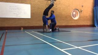 Handstand to forward roll extension task