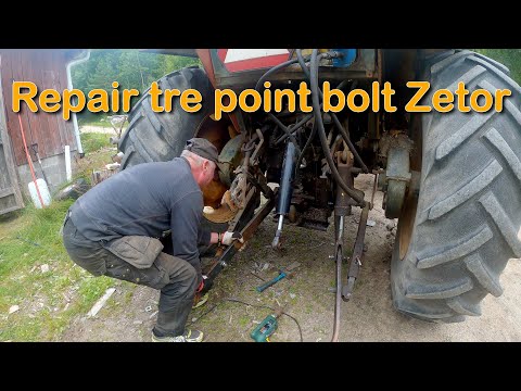 Fixing a bolt on the three-point on Zetor 7045 