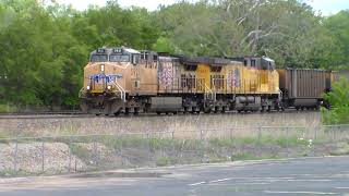 Westbound BNSF intermodal races a slow Westbound UP coal train in Kansas City, MO
