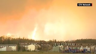 Residents flee as wildfire rages in Alberta