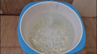 Mesmerizing Water Flow: Filling a Bucket with Tap Water