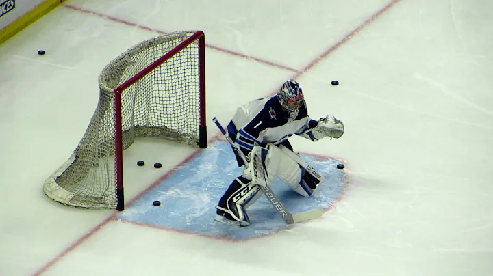 Hellebuyck and Comrie during pre-game warm-up at t...