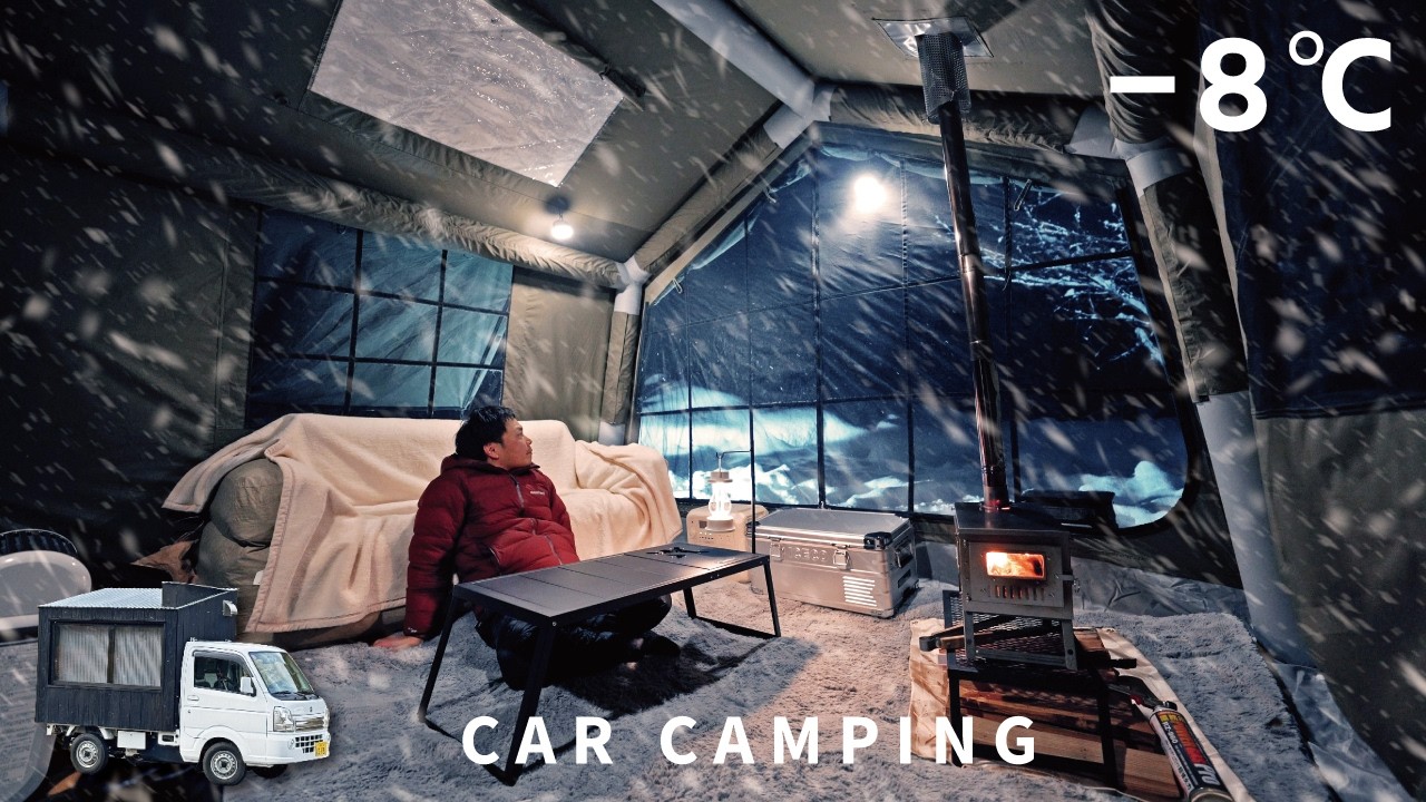 Холодный, сильный снег. Автомобильный кемпинг с использованием надувной палатки.