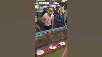 Winning "Stand Up the Bottle" Game at Calgary Stampede
