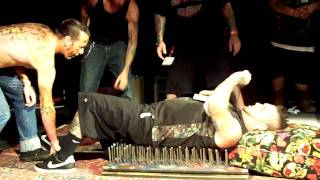 Captains Sideshow - bed of nails with cinder block breaks