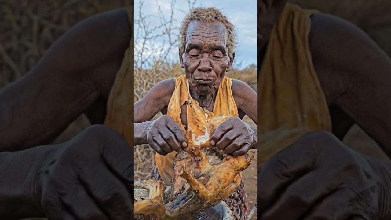 Hadzabe eating soft boiled meat cooked in forest style.