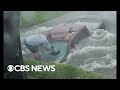 Dramatic shows texas couple rescuing truck driver from flooded ditch