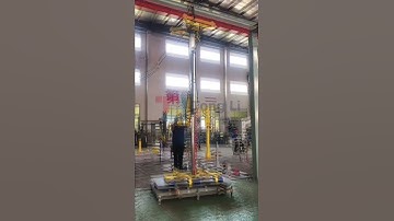 Gantry manipulator for handling iron plate.