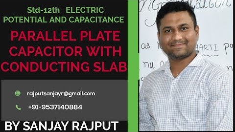 PARALLEL PLATE CAPACITOR WITH CONDUCTING SLAB