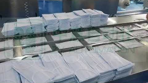 Face mask packaging machine