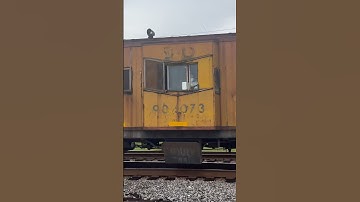 L766 heading thru Wabash road with old Chessie System caboose