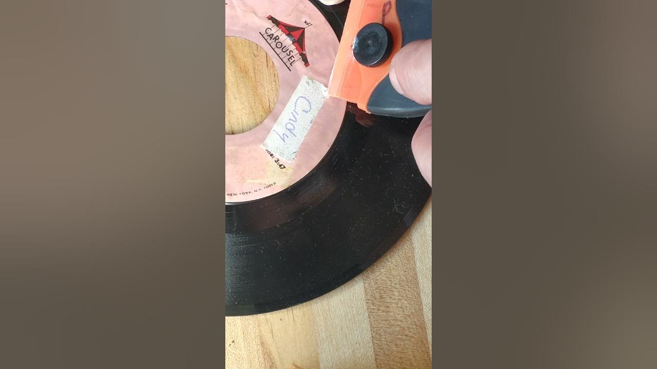 removing old tape from a record label using Undu® 