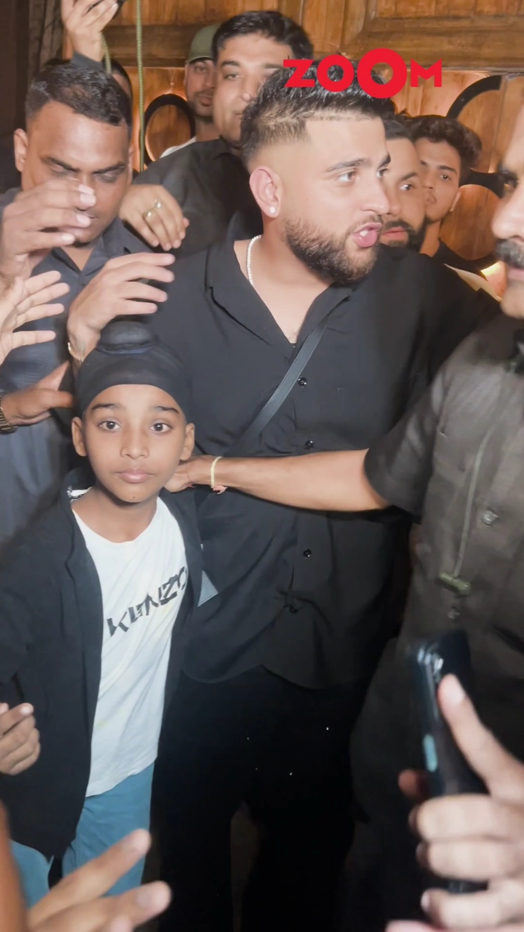 Karan Aujla STOPS bodyguard as he pushes a small fan from getting a pic with the singer? #shorts