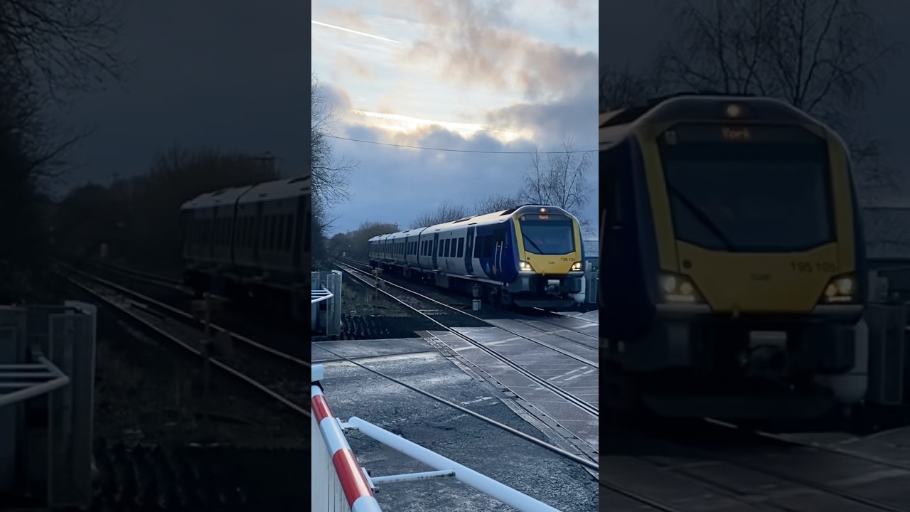 Class 195105 Passing through Huncoat Level Crossing 