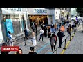 Queues and distancing as shoppers return to England’s high streets  - BBC News
