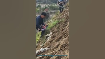 Slope Stabilization: Drilling Holes for Erosion-Control Plants